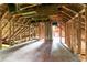 Unfinished attic featuring exposed wooden beams and framing, ready for customization at 1699 Emerald Sw Ave, Atlanta, GA 30310