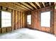 Unfinished living room featuring exposed wooden beams and framing, ready for customization at 1699 Emerald Sw Ave, Atlanta, GA 30310