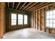 Unfinished living room featuring exposed wooden beams and framing, ready for customization at 1699 Emerald Sw Ave, Atlanta, GA 30310