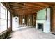 Renovated living room with fireplace, exposed wood framing, and an open doorway at 1699 Emerald Sw Ave, Atlanta, GA 30310