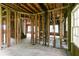 Unfinished living room featuring exposed wooden beams and framing, ready for customization at 1699 Emerald Sw Ave, Atlanta, GA 30310