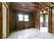 Living room featuring hardwood floors and exposed framing, ready for personalized renovation at 1699 Emerald Sw Ave, Atlanta, GA 30310