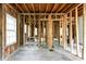 Unfinished living room featuring exposed wooden beams and framing, ready for customization at 1699 Emerald Sw Ave, Atlanta, GA 30310