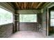 Sunroom with large windows, brick walls, and tiled flooring offering lots of natural light at 1699 Emerald Sw Ave, Atlanta, GA 30310