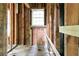 Upstairs unfinished landing featuring exposed wooden beams and framing, ready for customization at 1699 Emerald Sw Ave, Atlanta, GA 30310