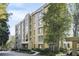 Tan multi-story building with mature trees and a covered entrance, nestled in a lush green landscape at 2769 Peachtree Ne Rd # 10, Atlanta, GA 30305