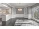Open living space with an adjacent kitchen featuring white cabinets and a dining area at 2769 Peachtree Ne Rd # 10, Atlanta, GA 30305