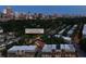 An aerial twilight view of residential townhomes with the Atlanta skyline in the background at 384 16Th Nw St # 1, Atlanta, GA 30363