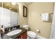 Well-appointed bathroom with granite countertop, decorative mirror, and stylish shower curtain at 384 16Th Nw St # 1, Atlanta, GA 30363