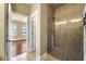 Modern bathroom featuring a glass-enclosed shower and a view of the bedroom at 384 16Th Nw St # 1, Atlanta, GA 30363