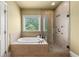 Bathroom with a jacuzzi tub with a separate glass door shower and tile at 384 16Th Nw St # 1, Atlanta, GA 30363