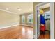 Spacious bedroom with hardwood floors and walk-in closet filled with clothes, storage and natural lighting at 384 16Th Nw St # 1, Atlanta, GA 30363