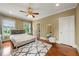 Spacious bedroom with hardwood floors, large windows, and a modern ceiling fan at 384 16Th Nw St # 1, Atlanta, GA 30363