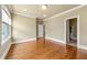 Bright bedroom showcasing hardwood floors, with views and a connecting door to another space at 384 16Th Nw St # 1, Atlanta, GA 30363