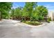 Exterior view of townhomes with garage and tree lined street on a sunny day at 384 16Th Nw St # 1, Atlanta, GA 30363