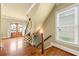 Inviting foyer with hardwood floors, decorative lighting, and a staircase leading to the upper level at 384 16Th Nw St # 1, Atlanta, GA 30363