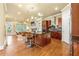 Open-concept kitchen with a large island, stainless steel appliances, and hardwood floors at 384 16Th Nw St # 1, Atlanta, GA 30363