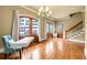 Spacious room featuring wood floors, chandelier and access to the balcony, and a staircase at 384 16Th Nw St # 1, Atlanta, GA 30363