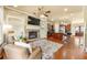 Open living space with fireplace, built ins and kitchen view at 384 16Th Nw St # 1, Atlanta, GA 30363