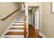 Elegant staircase with wood treads and handrail complements the neutral wall tones and hardwood floors at 384 16Th Nw St # 1, Atlanta, GA 30363