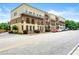 Charming townhomes with brick and tan exteriors line the street, offering urban living at its finest at 384 16Th Nw St # 1, Atlanta, GA 30363