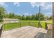 Expansive wooden deck with black railings, perfect for outdoor entertaining and relaxing at 7928 S Giles Rd, Douglasville, GA 30135