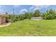 Large backyard with a detached two-car garage and mature trees providing ample privacy at 7928 S Giles Rd, Douglasville, GA 30135