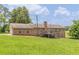 Wide backyard featuring a brick house with a deck at 7928 S Giles Rd, Douglasville, GA 30135