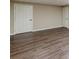 Finished basement features wood-look floors, neutral walls, and white trim at 7928 S Giles Rd, Douglasville, GA 30135