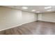 Spacious basement featuring wood floors, neutral paint, and recessed lights at 7928 S Giles Rd, Douglasville, GA 30135
