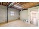 Unfinished basement with painted walls and an open doorway at 7928 S Giles Rd, Douglasville, GA 30135