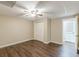 Basement area featuring wood-look floors, drop ceiling and a large closet with double doors at 7928 S Giles Rd, Douglasville, GA 30135