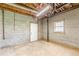 Unfinished basement featuring concrete floors and exposed ceiling at 7928 S Giles Rd, Douglasville, GA 30135