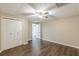 Finished basement featuring wood-look floors, drop ceiling, closet, and access to another room at 7928 S Giles Rd, Douglasville, GA 30135