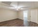 Spacious basement features wood-look floors, a ceiling fan, and easy access to the rest of the home at 7928 S Giles Rd, Douglasville, GA 30135