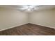 Finished basement featuring wood-look floors, drop ceiling with fan, and neutral walls at 7928 S Giles Rd, Douglasville, GA 30135
