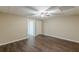 Finished basement with wood-look floors, neutral walls, drop ceiling, and access to an adjoining room at 7928 S Giles Rd, Douglasville, GA 30135