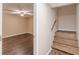 Basement stairs with a view of a finished room and ceiling fan at 7928 S Giles Rd, Douglasville, GA 30135