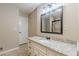 Bathroom with a granite countertop vanity, a decorative mirror and a walk-in shower at 7928 S Giles Rd, Douglasville, GA 30135