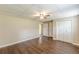 Bedroom features wood-look floors, neutral walls, and a ceiling fan at 7928 S Giles Rd, Douglasville, GA 30135