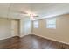 Bedroom showcasing wood-look flooring, neutral walls, and a double door closet, creating a cozy space at 7928 S Giles Rd, Douglasville, GA 30135