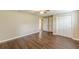 Bedroom with wood-look flooring and closet at 7928 S Giles Rd, Douglasville, GA 30135