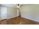 Bedroom featuring hardwood floors, neutral walls, and closet at 7928 S Giles Rd, Douglasville, GA 30135