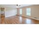 Bedroom featuring hardwood floors, neutral walls, and two windows at 7928 S Giles Rd, Douglasville, GA 30135