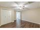 Bedroom featuring wood floors, a closet, and natural light at 7928 S Giles Rd, Douglasville, GA 30135