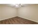 Neutral bedroom featuring wood floors, a ceiling fan, and fresh paint at 7928 S Giles Rd, Douglasville, GA 30135