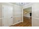 Inviting entryway featuring hardwood floors and neutral paint tones, leading to an open living space at 7928 S Giles Rd, Douglasville, GA 30135