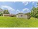Backyard view of a house and the smaller garage structure at 7928 S Giles Rd, Douglasville, GA 30135