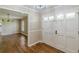 Inviting foyer with hardwood floors and a stylish front door entrance at 7928 S Giles Rd, Douglasville, GA 30135