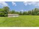 Exterior shot of a two-car garage with white doors on a large grassy lot at 7928 S Giles Rd, Douglasville, GA 30135